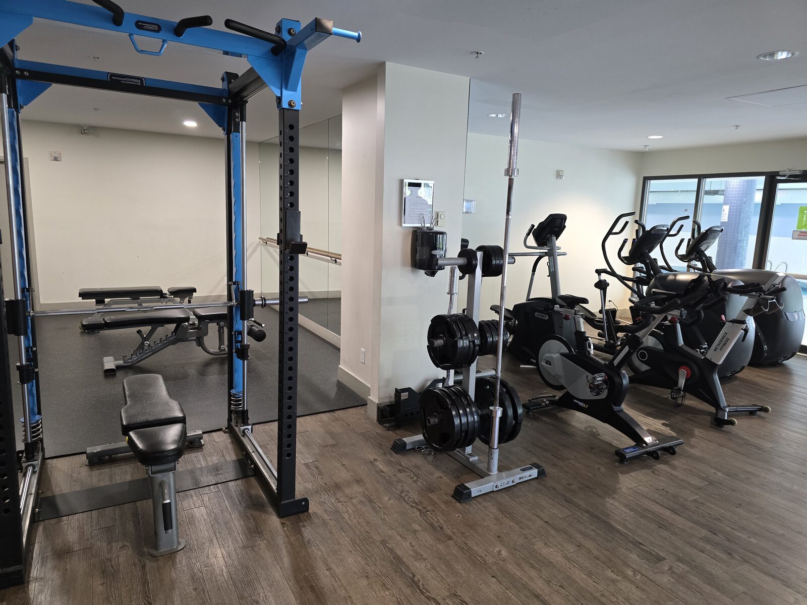 Fitness centre squat rack, free weights and elliptical machines