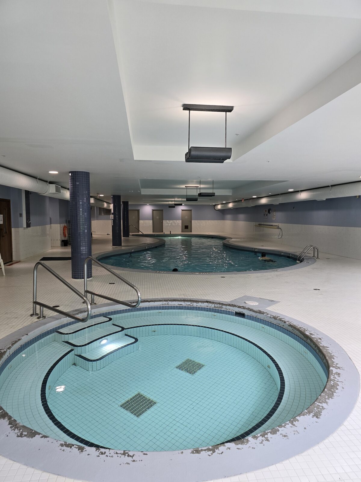 Indoor pool and hot tub shown together