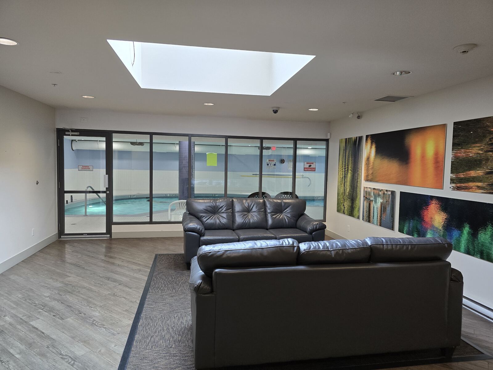 Pool-side lounge with seating and artwork
