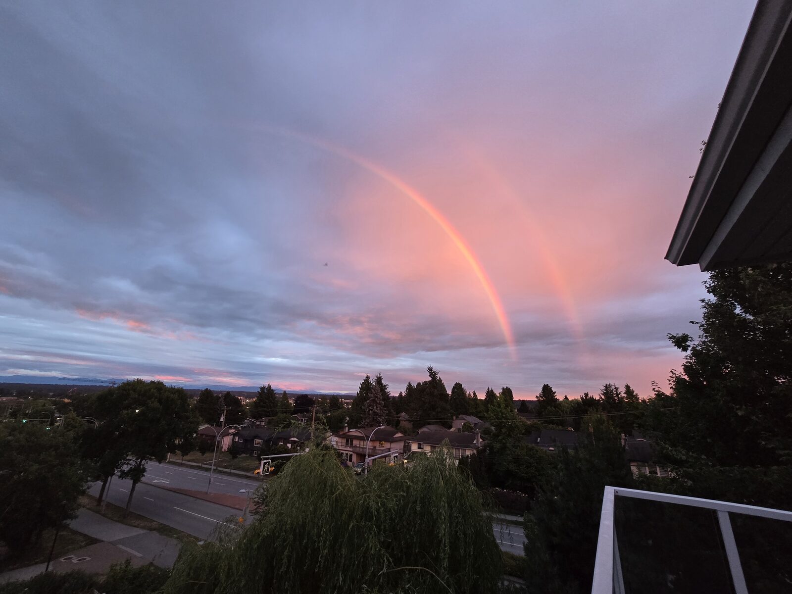Rainbow over Surrey seen from the private balcony at dusk