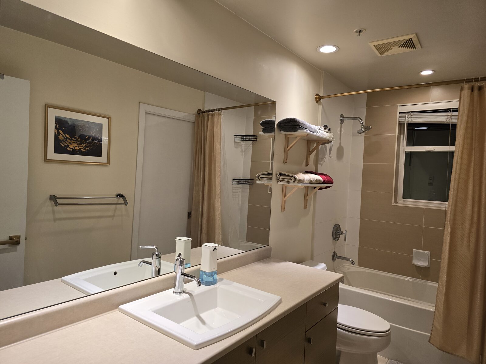 Extra-wide bathroom vanity and mirror with sensor soap dispenser