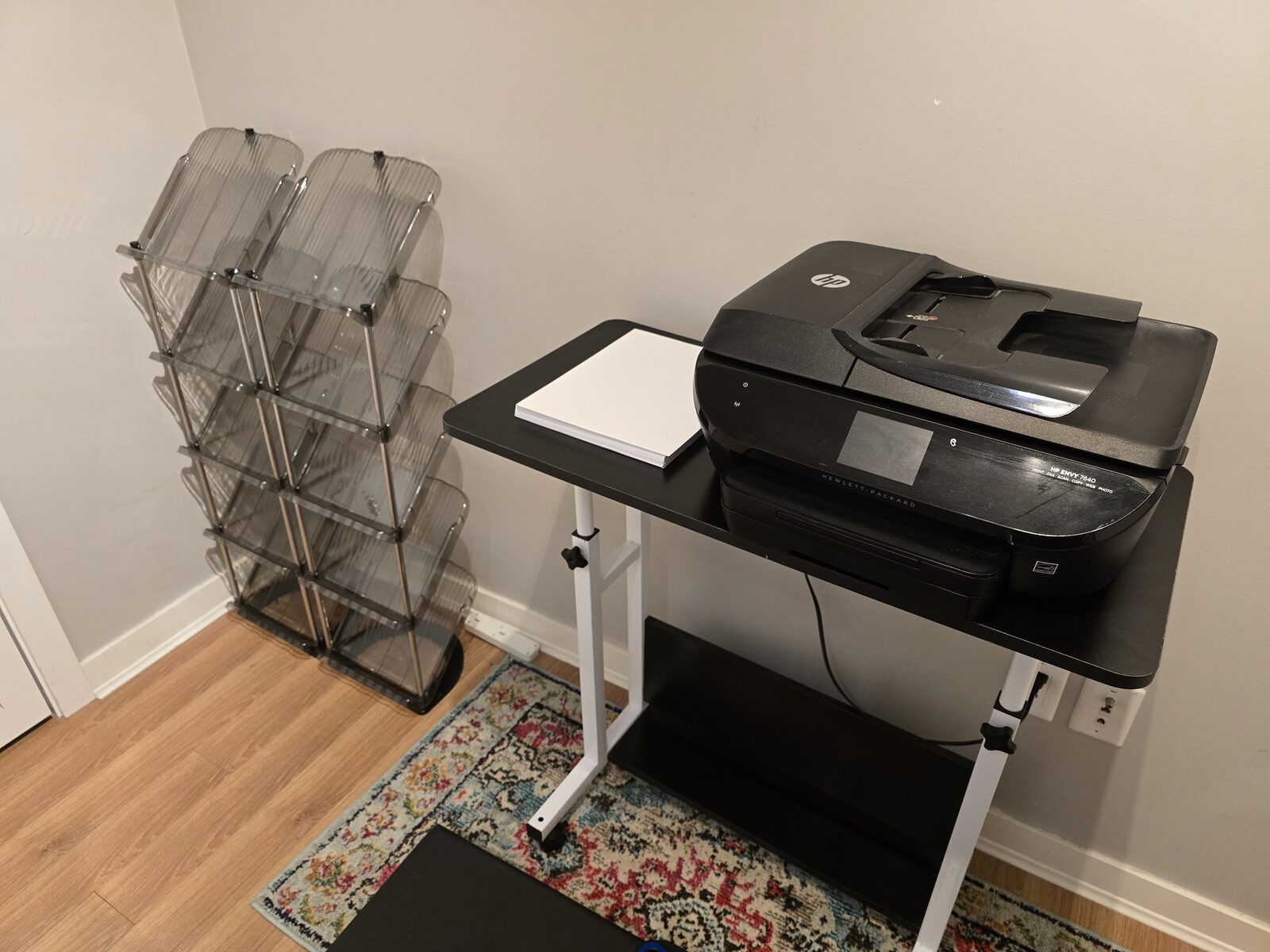 Printer and desk area with additional closet storage in the fitness room