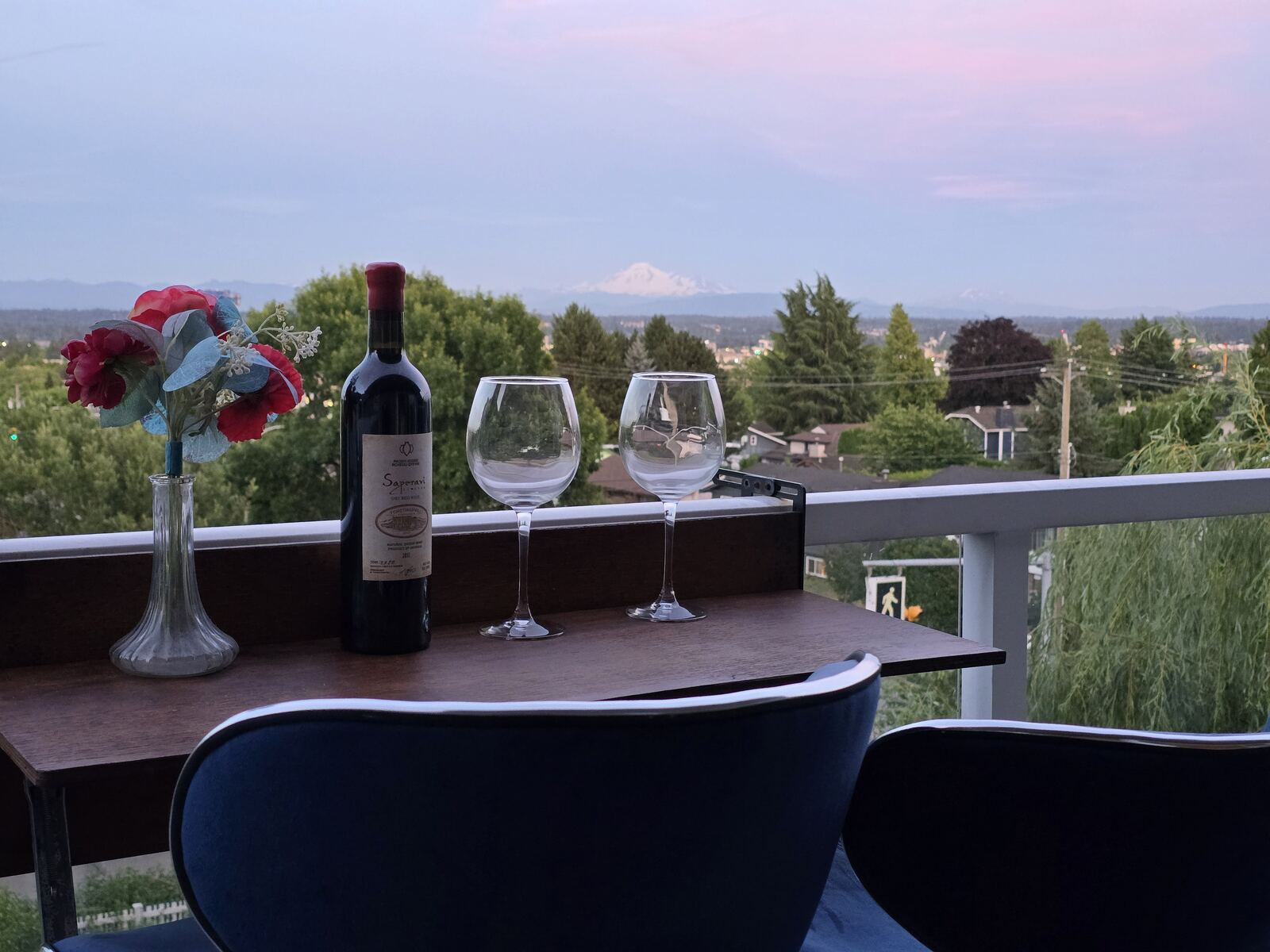 Wraparound balcony at sunset with Mount Baker on the horizon