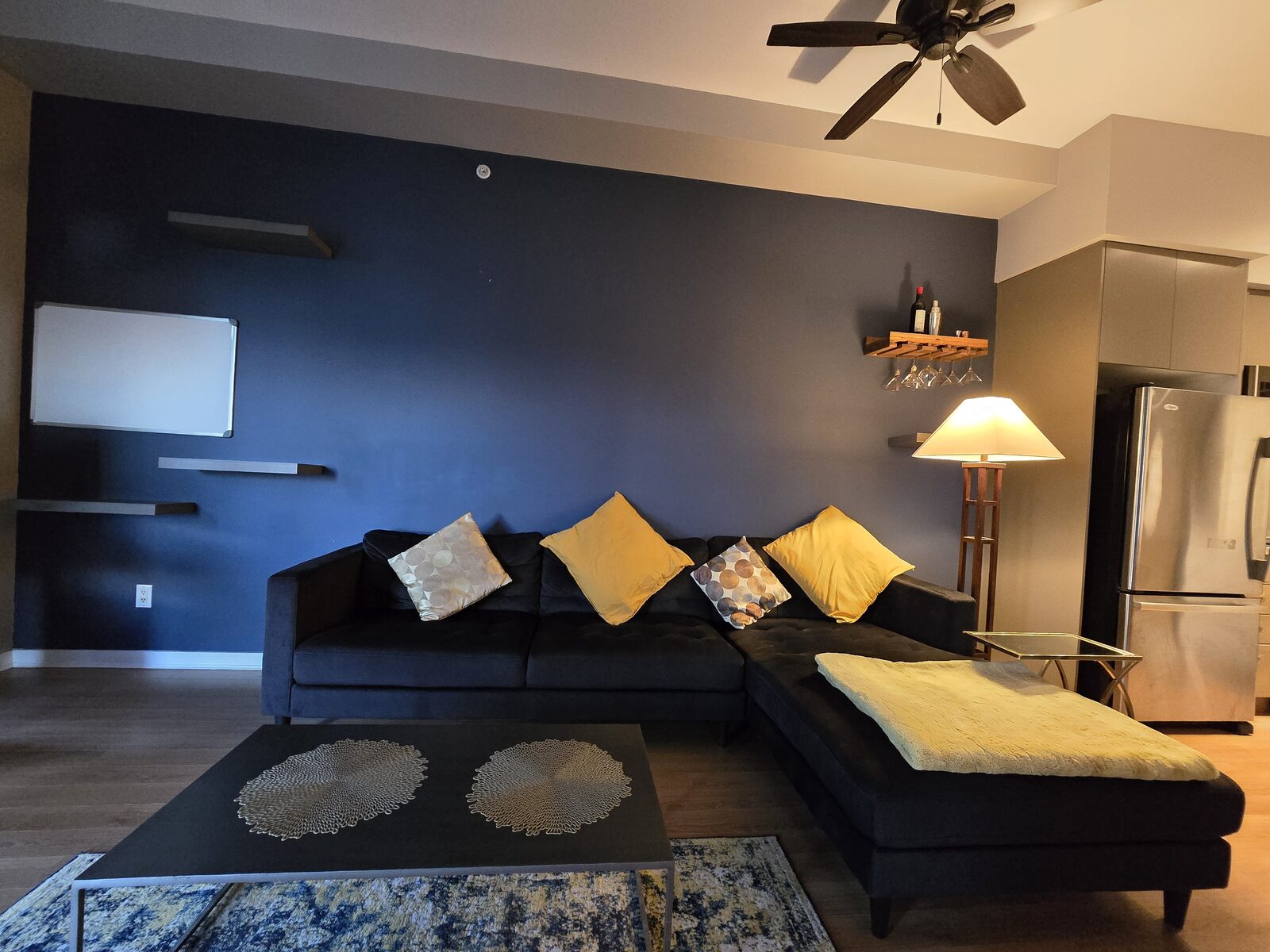 Sectional sofa and coffee table with view into the kitchen